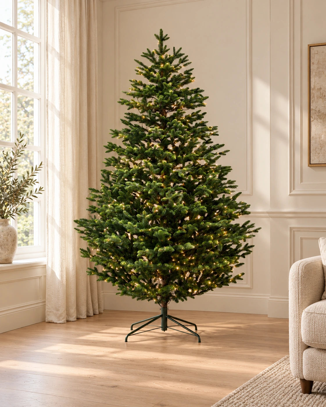 Sheringham - 6ft Pre-Lit Artificial Christmas Tree shown in a softly lit sitting-room corner. Styled visualisation.
